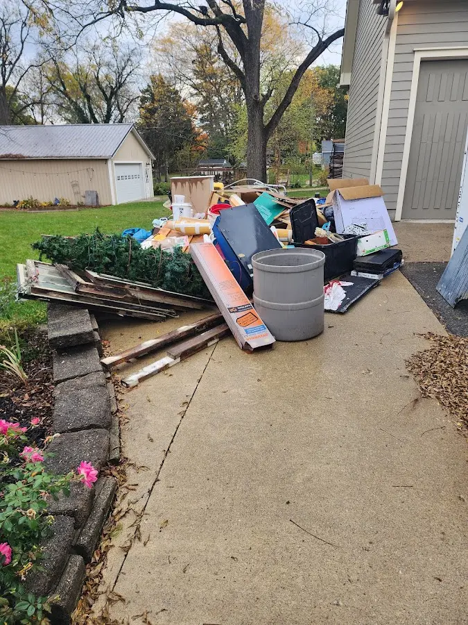 Dumpster being loaded with debris for 30 Yard Dumpster Rental in Warner Robins